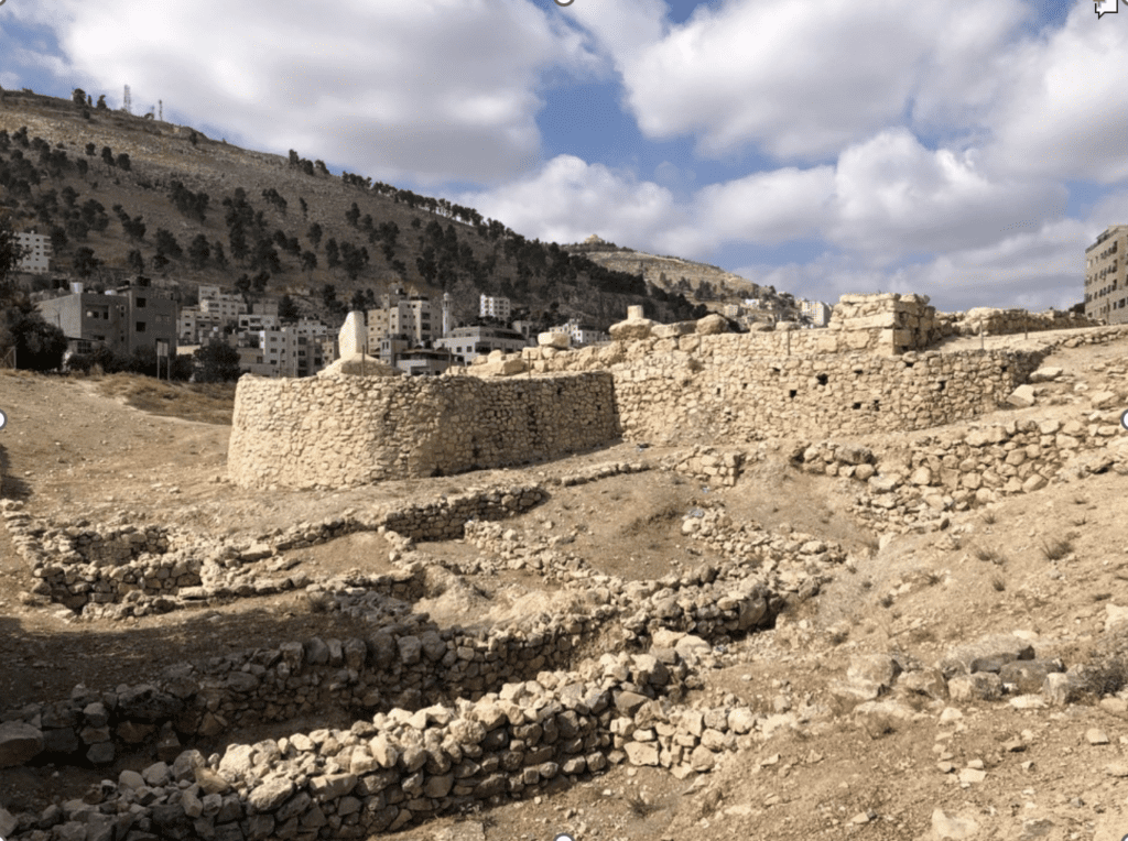 Ancient Shechem, with the mountains Ebal and Gerizim in the background, as well as modern Nablus in the West Bank. Photo by author.