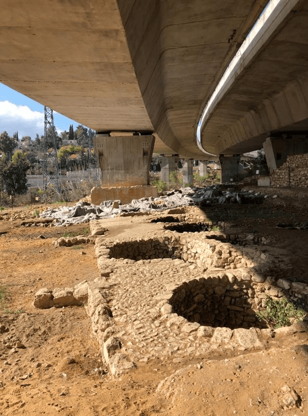 Remains of Tel Motza. It was discovered by construction workers as they built a bridge across a valley. As you can see, parts of the site were destroyed in the construction process. The site is of interest because excavators found a small, fully functional replica of the Jerusalem Temple built here. Photo by John Buckner