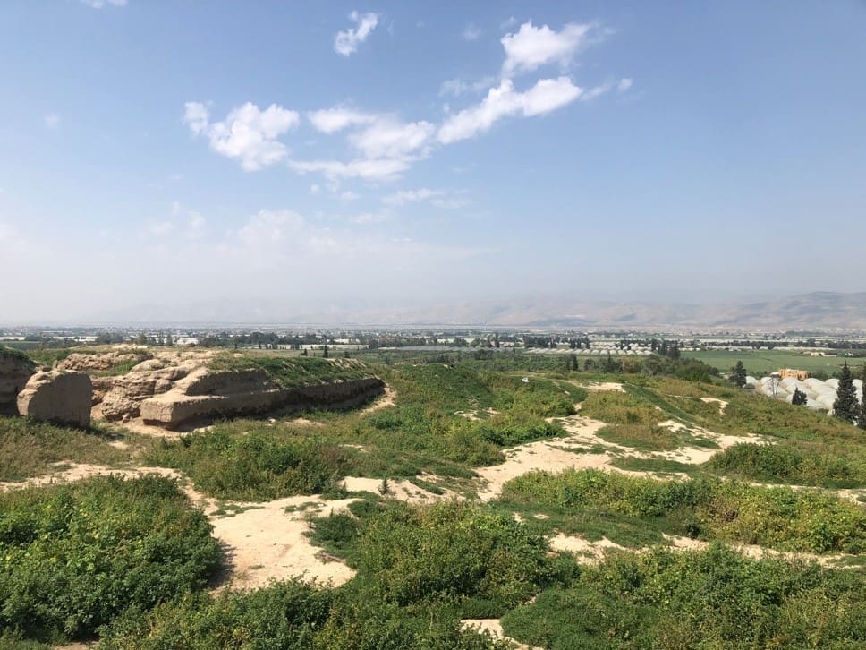 The ruins of Succoth/Tell Deir Alla looking west toward the plains of Jordan, the river valley, and the river itself. In the distance are the hills of Samaria. Photo by John Buckner