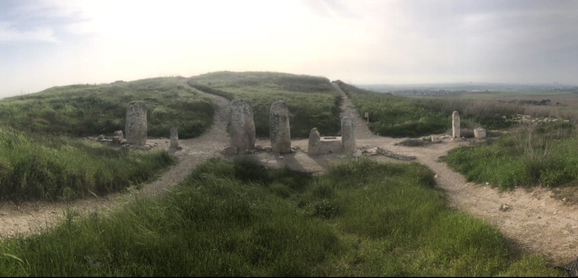 Idolatrous pillars in Gezer. The row contains ten standing stones, an altar, as well as a stone basin. Despite what Deuteronomy commands, the pillars are not broken. Photo by John Buckner