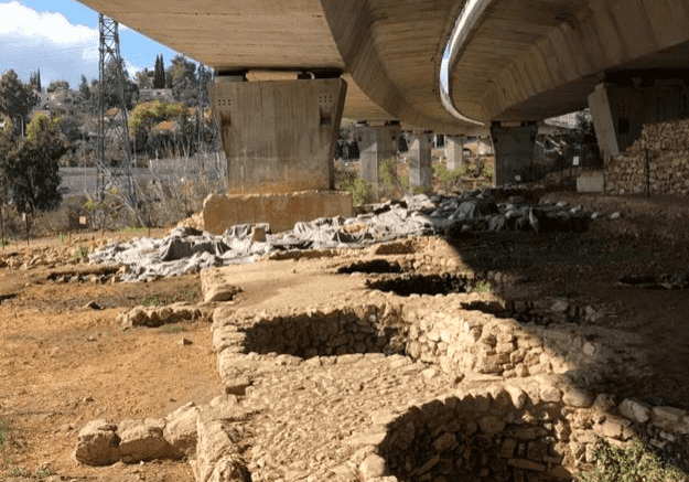 Remains of Tel Motza. It was discovered by construction workers as they built a bridge across a valley. As you can see, parts of the site were destroyed in the construction process. The site is of interest because excavators found a small, fully functional replica of the Jerusalem Temple built here. Photo by John Buckner